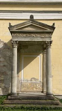 Classical architectural detail featuring a blocked niche framed by two carved Stock Photos