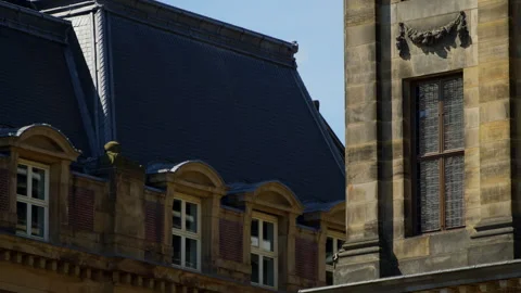 Classical architecture in Amsterdam with a clear blue sky and parallax 스톡 동영상 323367442