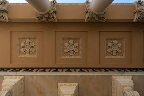 Classical architecture facade close up with decorative flower stucco rosettes Foto stock
