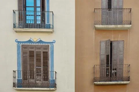 Classical balconies of different colours and ornaments on the antique histo.. Stock Photos
