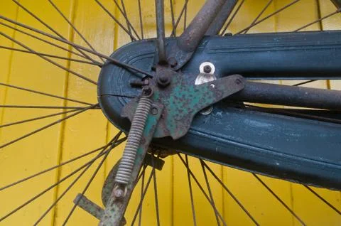 Classical bike engine on yellow wall Stock Photos