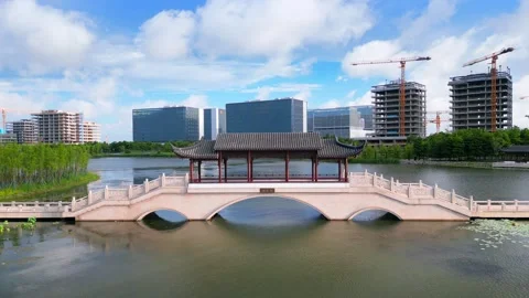 Classical Bridge and Modern Architecture by Dishui Lake in Shanghai Lingang New 스톡 동영상 346955918