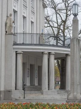 Classical building with columns and statues, surrounded by a park, stralsund, Fotos de archivo