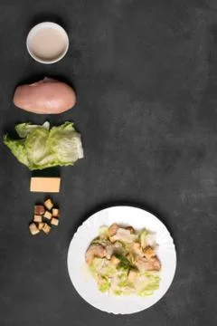 Classical Caesar salad with sliced chicken meat, cheese and fresh Stock Photos