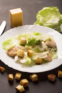 Classical Caesar salad with sliced chicken meat, cheese and fresh 스톡 사진