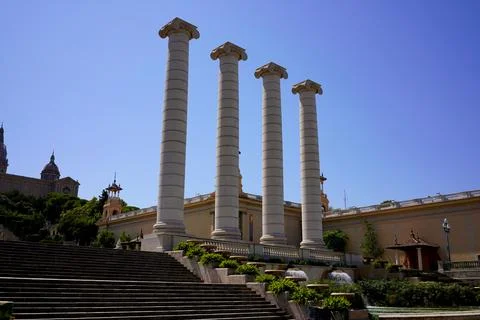 Classical columns at the Magic Fountain area with blue sky and historic arc.. Stock Photos