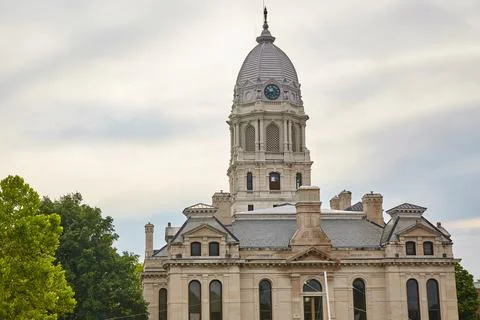 Classical Courthouse with Clock Tower and Lush Trees, Low Angle View 스톡 사진