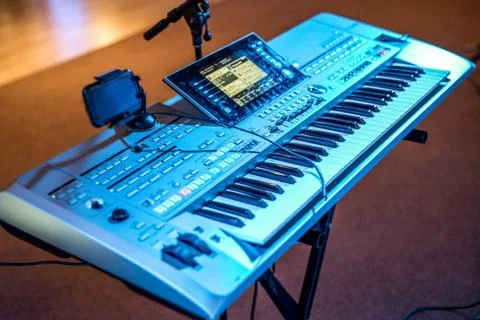 Classical electronical music keyboard view blue concert lights bokeh backgrou Stock Photos