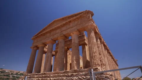 Classical greek temple columns against blue Sicilian sky Stock Footage 330356683
