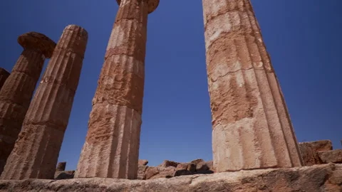 Classical greek temple ruins under clear Sicilian sky Stock Footage 330350148