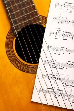 Classical guitar and notes Stock Photos