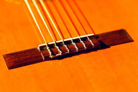Classical guitar showcasing its nylon strings Stock Photos