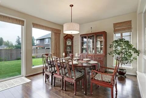 Classical interior of dining room in luxurious house with vintage furniture Stock Photos