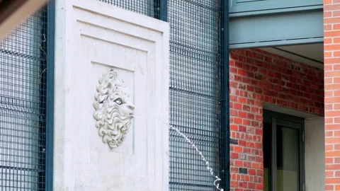 Classical Lion Head Architectural Bas Relief Wall Fountain Spitting Water Video stock 345615081