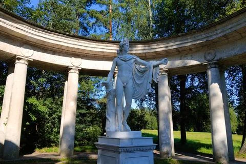 Classical Marble Apollo Statue in Circular Colonnade Stock Photos