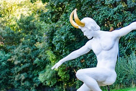 Classical marble statue reminiscent of ancient GreekRoman art, dynamically .. Stock Photos