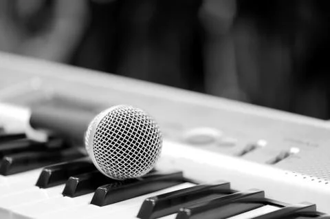 Classical microphone on keyboard Stock Photos