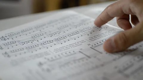 Classical musician's hand study classical music notes for classic concert Video stock 200490775