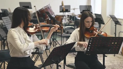 Classical musicians perfecting performance during rehearsal, adjusting dynamics Stock Footage 305542688