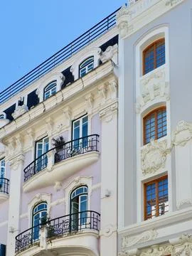 Classical old fashioned facades with elegant windows and balcony made in Po.. Stock Photos