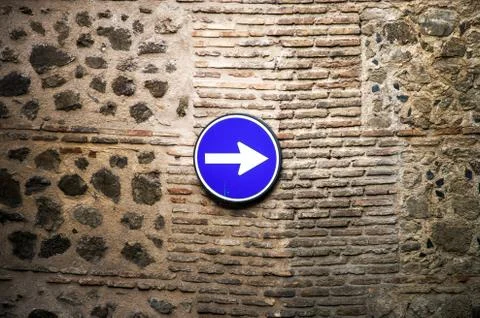 Classical road sign on ancient wall 스톡 사진