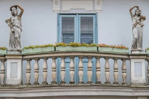 Classical Statues on Balcony with Flower Boxes Stock Photos