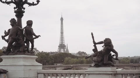 Classical statues on bridge Alexandre III and  eiffel tower in the background Stock Footage 67886475