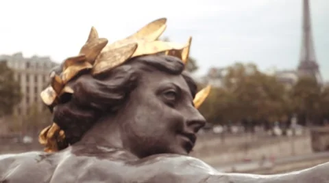 Classical statues on bridge Alexandre III and  eiffel tower in the background Stock Footage 67886482
