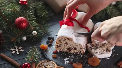 Classical stollen on dark background cut into slices. Stock Footage 166975977