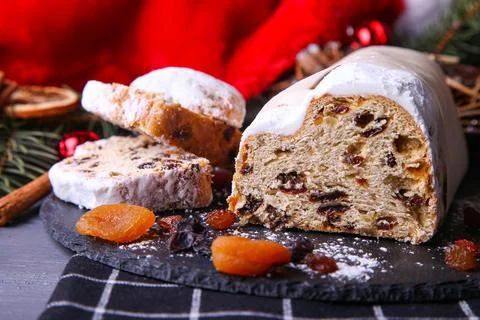 Classical stollen on dark background. Traditional Christmas festive pastry de Stock Photos