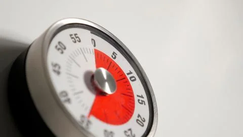 Classical vintage kitchen countdown timer close up, 35 minutes remaining Stock Photos