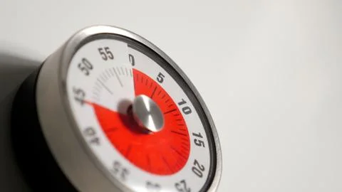 Classical vintage kitchen countdown timer close up, 45 minutes remaining Stock Photos