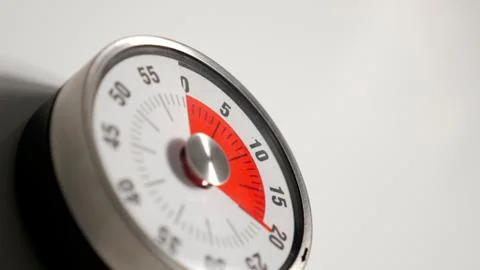 Classical vintage kitchen countdown timer close up, 20 minutes remaining Stock Photos