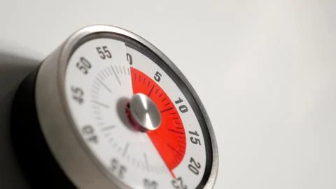 Classical vintage kitchen countdown timer close up, 25 minutes remaining Stock Photos