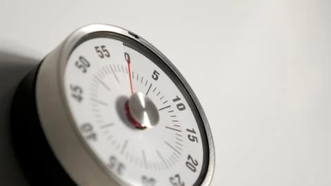 Classical vintage kitchen countdown timer close up, 0 minutes remaining Stock Photos