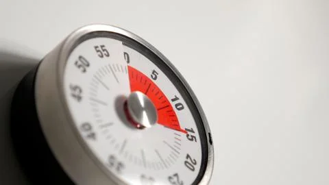 Classical vintage kitchen countdown timer close up, 15 minutes remaining Stock Photos