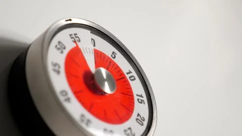 Classical vintage kitchen countdown timer close up, 55 minutes remaining Stock Photos