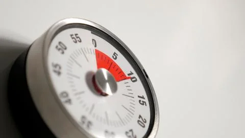 Classical vintage kitchen countdown timer close up, 10 minutes remaining Stock Photos