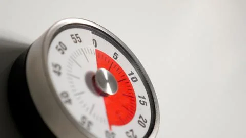 Classical vintage kitchen countdown timer close up, 30 minutes remaining Stock Photos