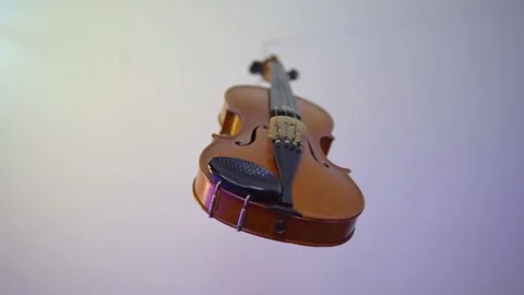 Classical violin hooked to the ceiling nobody and nothing around Video stock 142191036