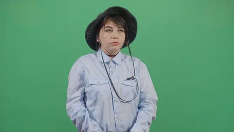 Classical woman explorer chasing something in the frame with binoculars studio Stock Footage 117977572