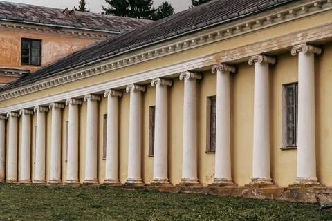 Classical Yellow Building with Row of White Columns Photos