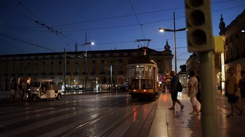 Classical yellow tram passing by commerce square (Para do commercio) and people Stock Footage 89542828