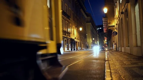Classical yellow tram passing the street of Lisbon at night. Stock Footage 103444101