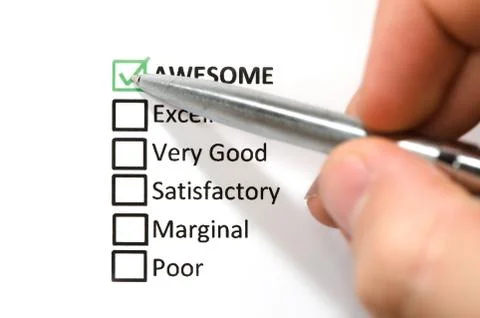 Classification choice list, hand holding silver pen. Stock Photos