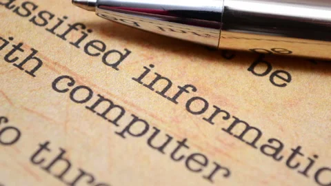 Classified Information Document with Pen Representing Confidential Data Stock Footage 339633429