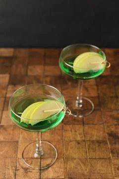 Classik Apple martini - appletini, cold summer cocktail with gin, apple liqueur Stock Photos