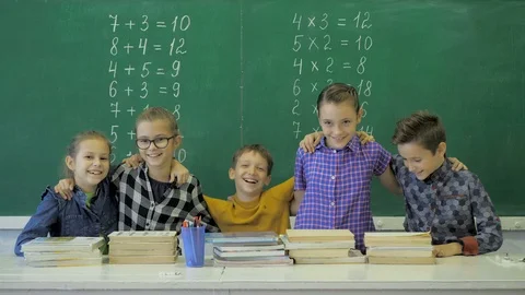 Classmates posing together in a classroo... | Stock Video | Pond5