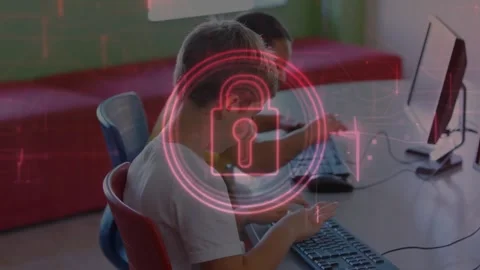 Classmates typing in computer lab, starting red overlay forming padlock Stock Footage 317185226