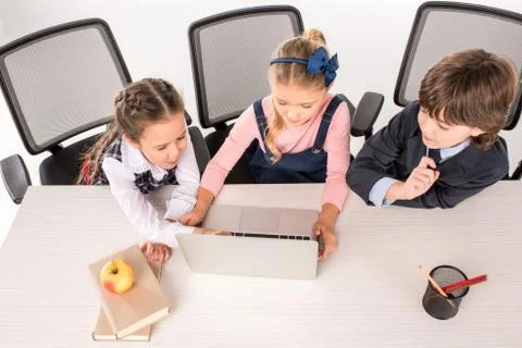 Classmates using laptop Stock Photos